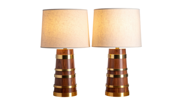 Pair of elegant, mid-century modern lamps.  Cream-colored lampshades,  wooden bases with brass accents,  ring-like brass bands