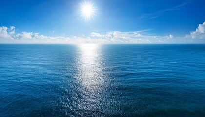 Obraz premium Blue Ocean Panorama With Sun Reflection The Vast Open Sea With Clear Sky Ripple Wave And Calm Sea With Beautiful Sunlight