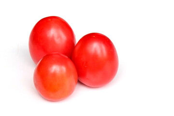 Ripe red tomatoes on white background
