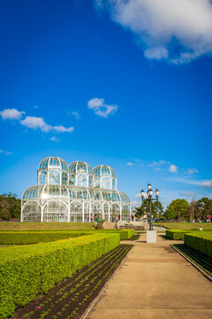 Botanical Garden of Curitiba on a sunny day with blue sky and lush tropical vegetation