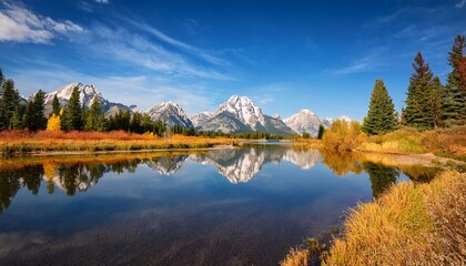 Naklejka premium The Majestic Grand Teton Mountains Reflect Beautifully In The Serene River Creating A Stunning Natural Scene