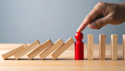 Concept of protection, prevention, and leadership with a red person stopping falling blocks.