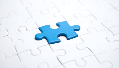 Blue puzzle piece fitting into place symbolizing solution, teamwork, and business strategy.