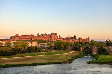 Medieval fortress on hill in at sunrise
