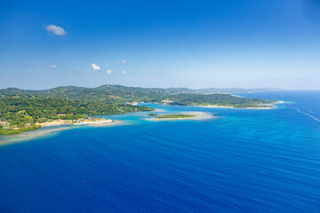 Aerial view of Tropical island coastline © Pete Niesen Photo