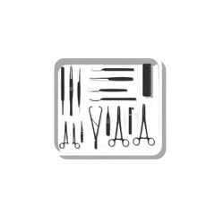 Surgical instruments arranged neatly on a tray for medical procedures.