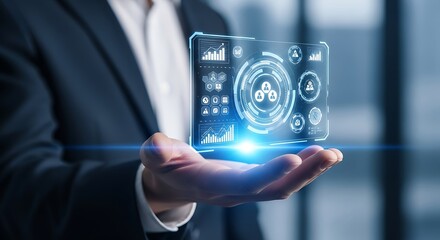 Hand holding futuristic holographic screen with business analytics and data charts technology