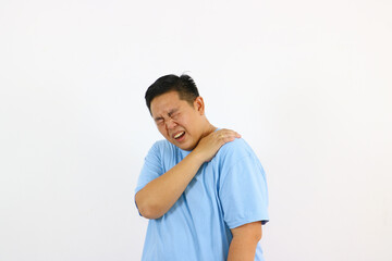Man suffering from bad shoulder pain