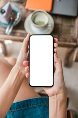 Close-up of a woman holding a smartphone with a blank screen, perfect for app mockups or custom content.