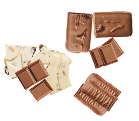 assortment of indulgent milk and white chocolate pieces on a dark background