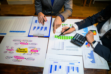 Business partners analyzing company financial data and strategy