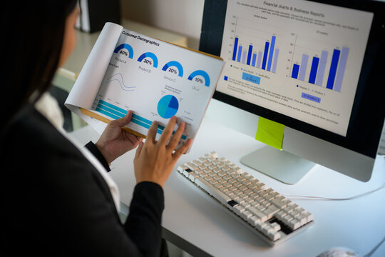 Woman analyzing business financial report consumer demographics