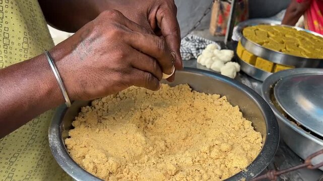 Sattu filling for making Dal puri at a road side stall in Bihar, India