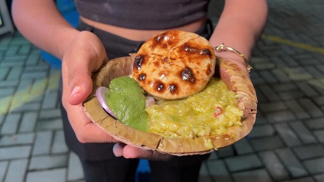 Litti chokha with green chutney served in a street cart in India