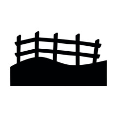Rustic wooden fence silhouette against a hilltop
