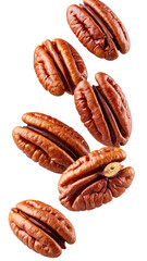 Pecan halves in mid-air