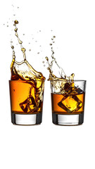 Two whiskey glasses with splashing liquid and ice