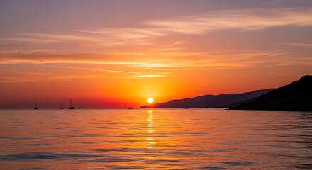 Obraz premium Sunset over the ocean with vibrant colors and reflections.