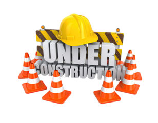 Construction warning sign with hard hat and traffic cones