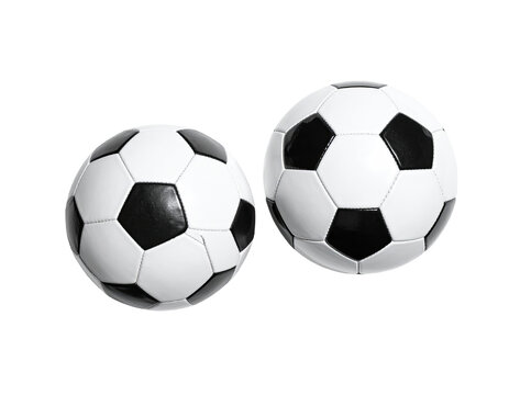 Two soccer balls on black background