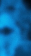 Abstract blue textured grainy background with dark shapes