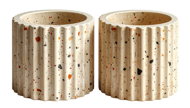 Two cream-colored, ribbed planter pots, featuring a speckled, terrazzo-like design