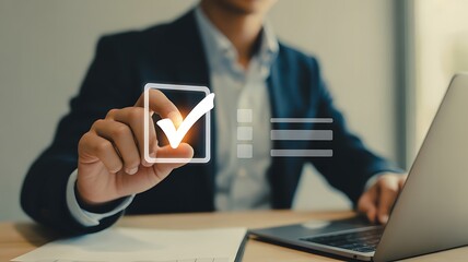 Businessman using laptop and touching check mark icon, business concept
