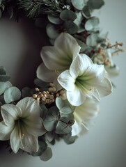 Elegant white amaryllis and fresh green eucalyptus leaves garland hanging on a plain neutral wall, minimalist holiday decoration concept, creating a peaceful and tranquil atmosphere