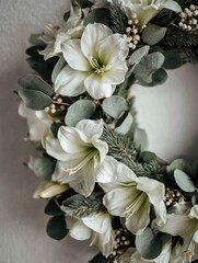 Elegant white amaryllis and fresh green eucalyptus leaves garland hanging on a plain neutral wall, minimalist holiday decoration concept, creating a peaceful and tranquil atmosphere