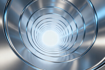 Close-up view of a metallic spiral structure with concentric rings and reflective surface
