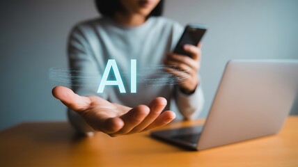 Woman holding ai text with laptop and smartphone on the table at office