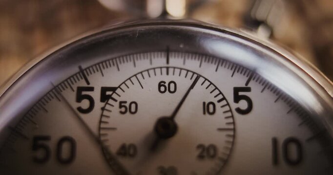 Time Lapse: Macro Close Up Shot of Mechanical Stopwatch with Metallic Case and Dial with Running Second Hand. Details Symbolizing Sports, Competition, Countdown, Measurement of Athletic Performance.