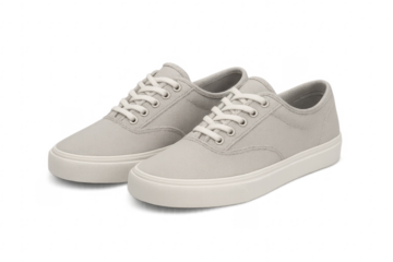 Pair of gray casual sneakers with white laces on transparent background