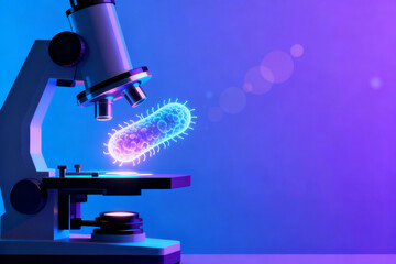 Microscope examining a glowing bacterium under purple lighting