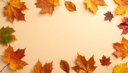 Top view of scattered autumn leaves on beige background, central copy space. Autumn background with natural foliage beauty and modern layout, for invitations, promotions, and branding.