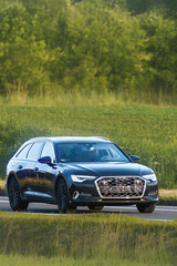 Wagon automobile on quiet countryside road