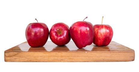 red apples on a wooden board