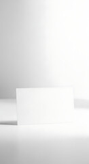 Blank White Rectangular Card Standing Vertically in a Clean Studio Setting