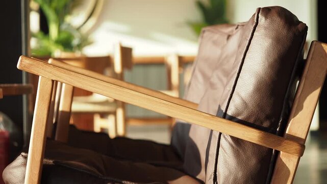 Wooden armchair with brown leather padding 4k video