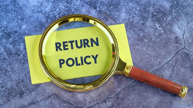 Concept of policy or return to policy. Animation of the RETURN POLICY concept phrase through a magnifying glass on a yellow paper note