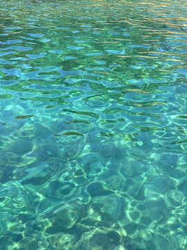 Emerald green clean sea water vertical.