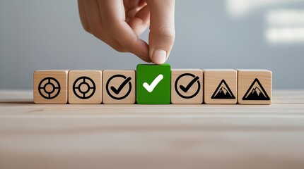 a sequence of wooden blocks with icons representing a goal