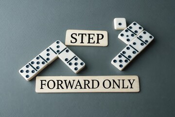 Dominoes Forming an Arrow Pointing Upward for Strategy