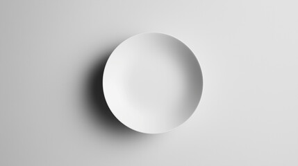 Minimalist Top-Down View of Plain White Ceramic Plate on Matte Grey Background, Soft Diffused Studio Lighting, High-Key Clean Commercial Appearance with Generous Negative Space