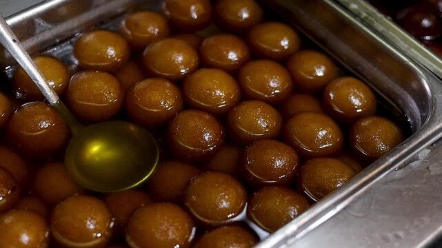 Gulab jamun or kaala jam indian dessert fried balls dipped in sugar syrup