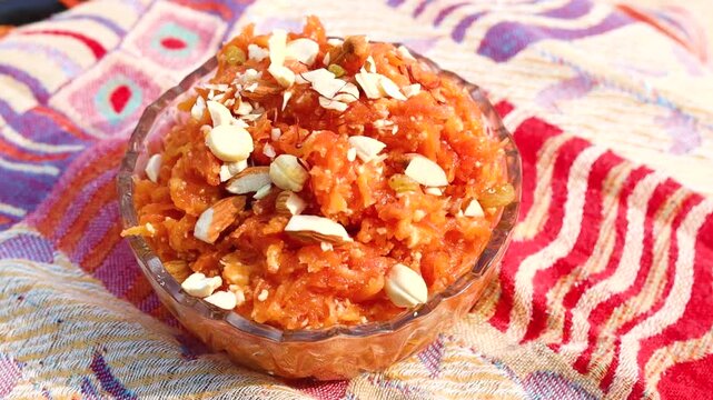 Gajar ka halwa is a sweet dessert pudding from India made from carrot, served in a bowl