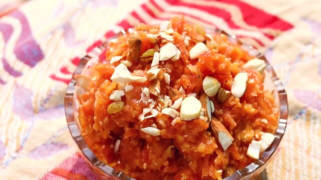 Gajar ka halwa is a sweet dessert pudding from India made from carrot, served in a bowl
