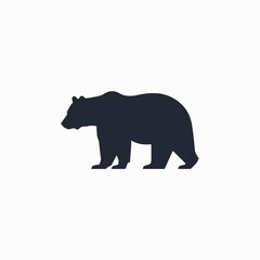 Fototapeta premium Dark gray bear silhouette in a standing pose. Simple 2D vector icon of a wild forest animal.