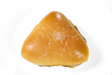 Soft triangular bun filled with savory tuna, topped with sesame seeds, perfect as a light and tasty snack. Bakery isolated on white background.