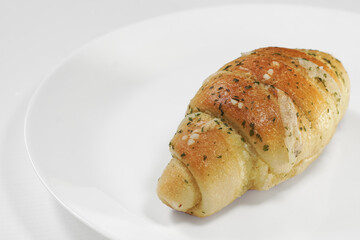 Shio Pan (Salted Butter Roll) Soft, fluffy bread with a golden crispy crust, filled with rich butter and a hint of sea salt. Savory, aromatic, and perfectly balanced in every bite. On white background